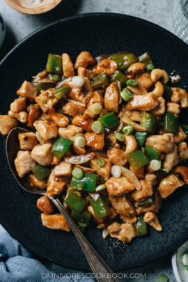 Cashew chicken served in a plate close up